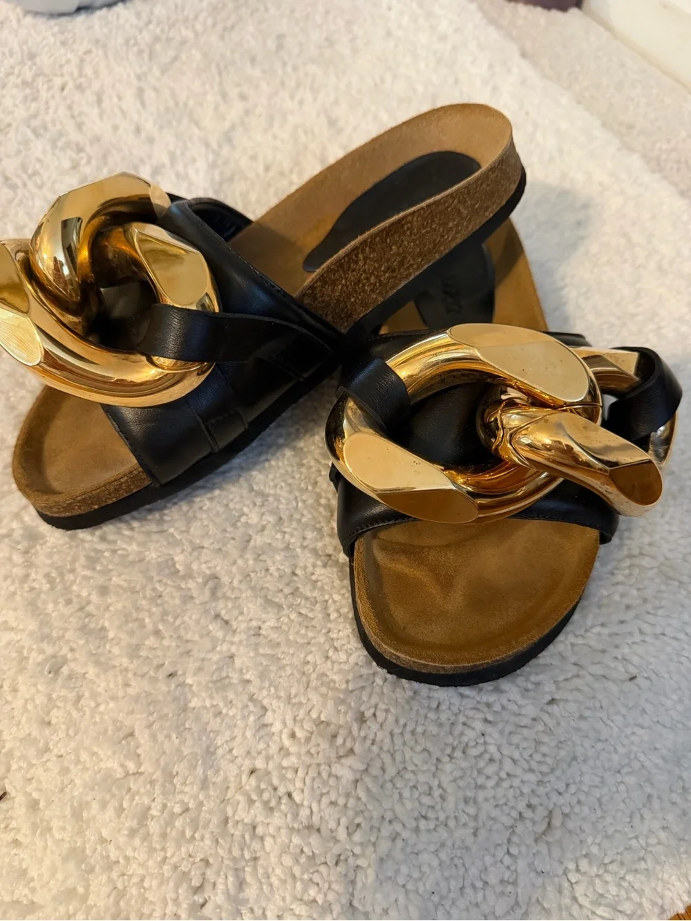 JW Anderson Women’s Black Slide Sandals with Gold Chain Accent
